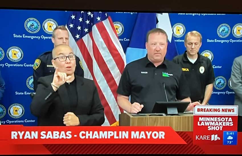 Mayor Ryan Sabas addressing the public at the Minnesota State Emergency Operations Center during a statewide crisis